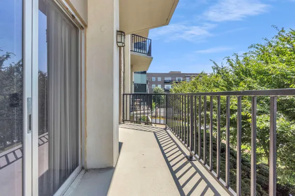 a balcony with wooden floor