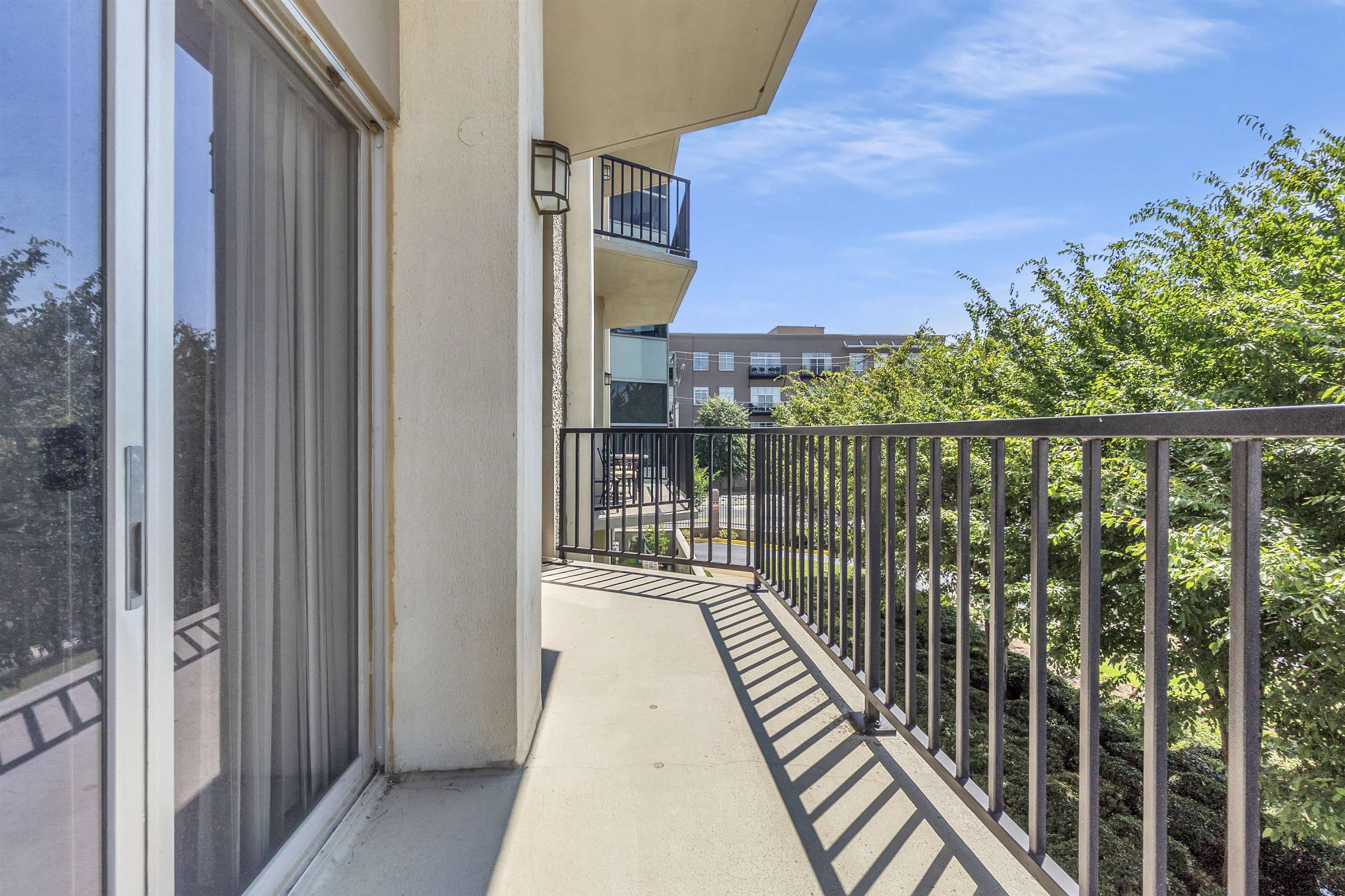 655 Riverside Drive, Unit 206 Memphis, TN 38103 - Photo 27 of 28 a balcony with wooden floor