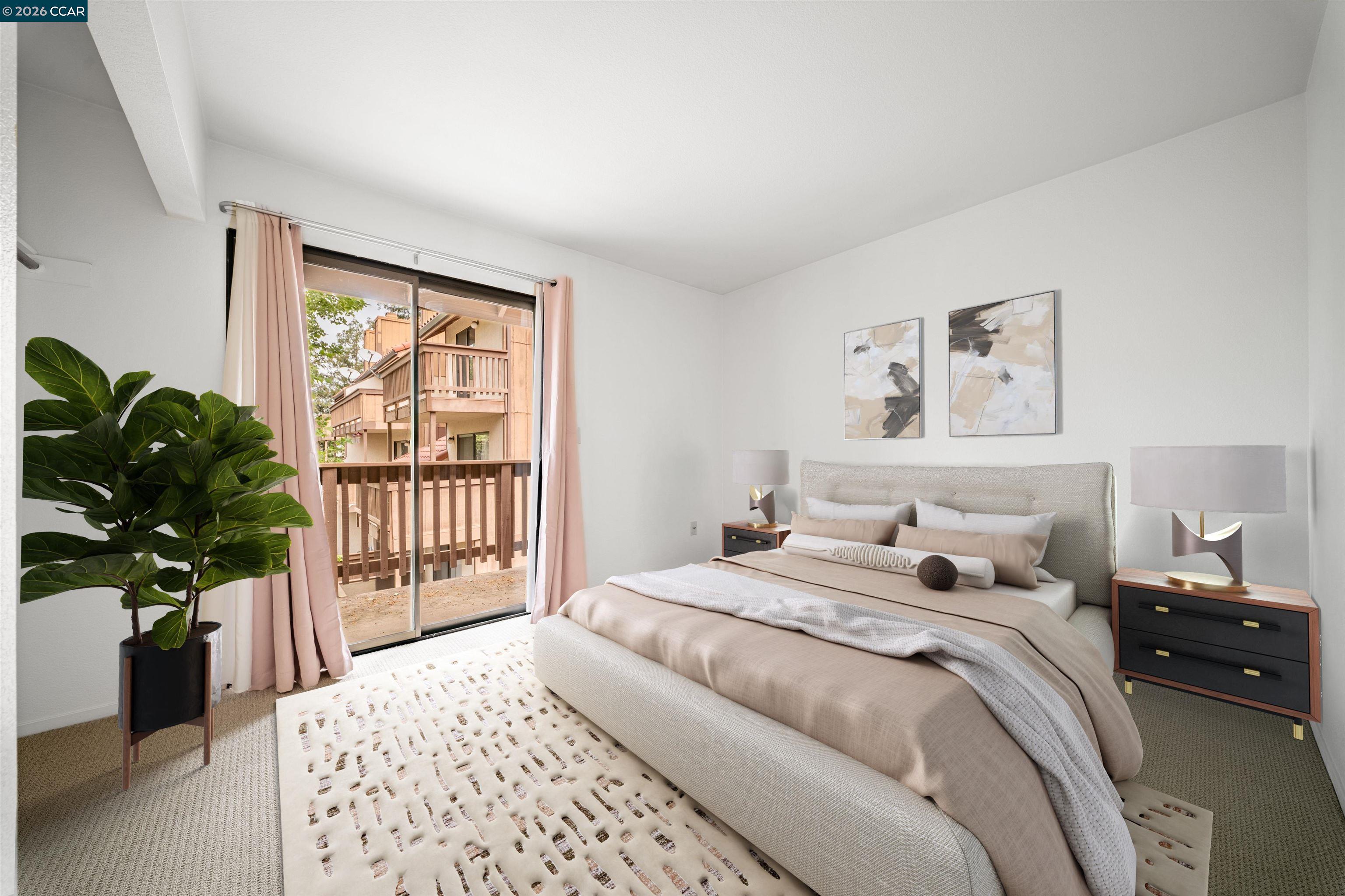2055 Sierra Road, Unit 106 Concord, CA 94518 - Photo 23 of 37 a bedroom with a large bed and a potted plant