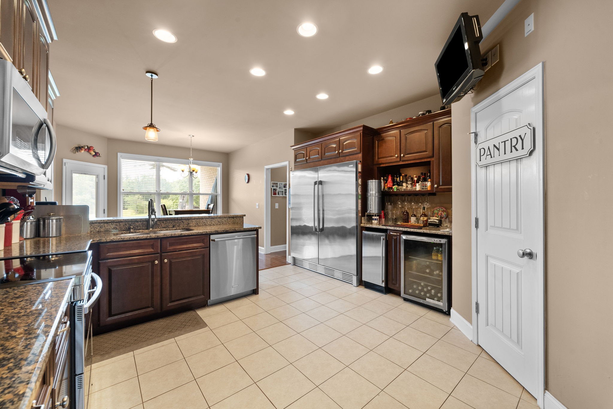 4940 Marion Road Cunningham, TN 37052 - Photo 11 of 43 a kitchen with stainless steel appliances granite countertop a refrigerator and a stove top oven