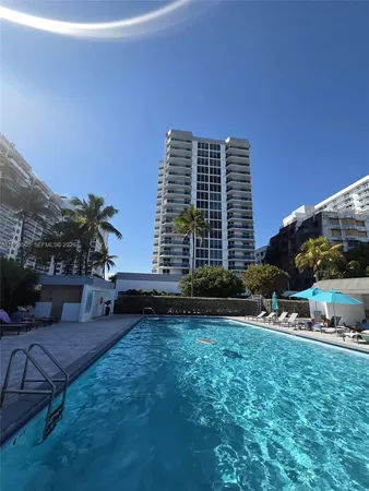 a view of an apartment with a backyard
