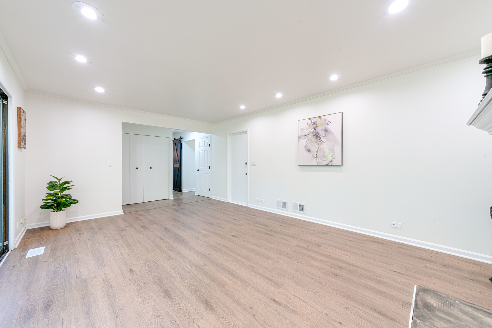 887 Saybrook Lane Buffalo Grove, IL 60089 - Photo 13 of 28 a view of an empty room with wooden floor