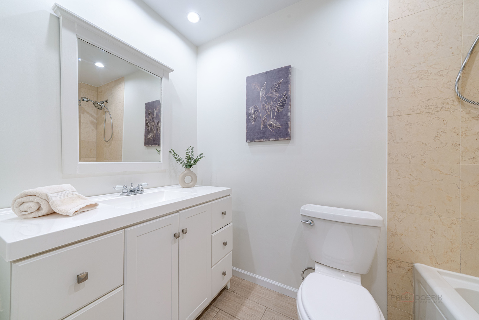 887 Saybrook Lane Buffalo Grove, IL 60089 - Photo 17 of 28 a bathroom with a granite countertop toilet sink and mirror