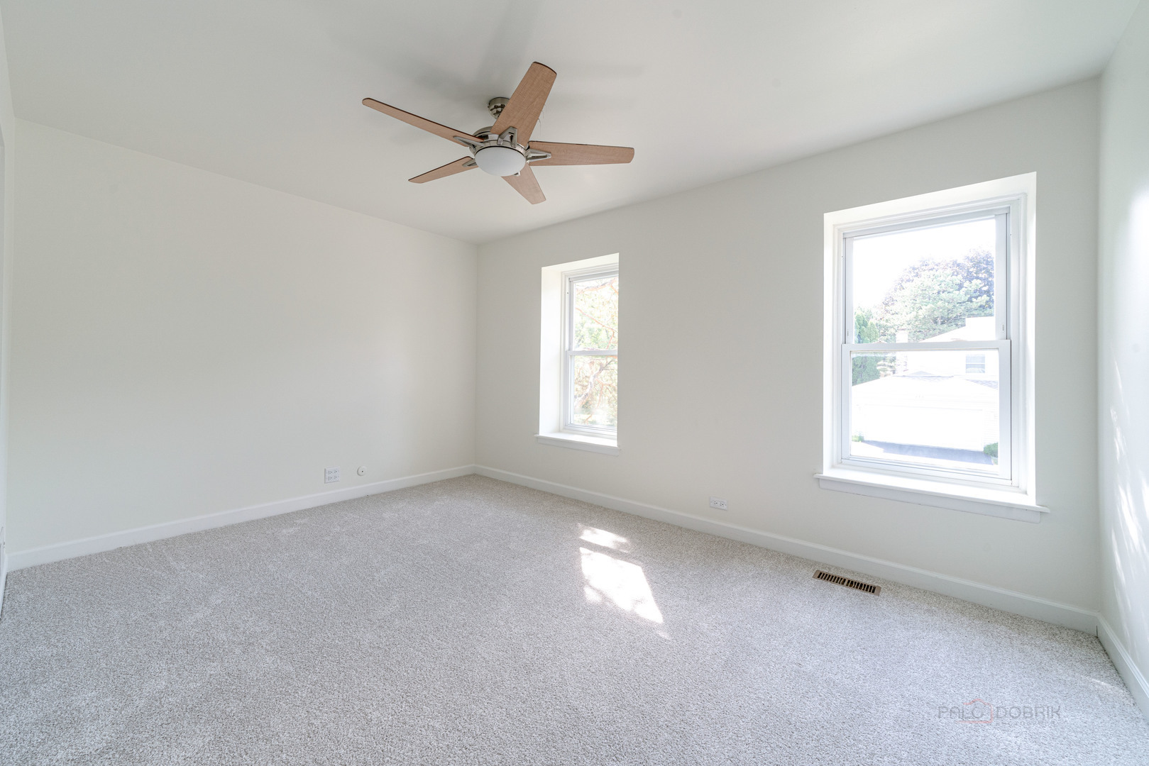 887 Saybrook Lane Buffalo Grove, IL 60089 - Photo 18 of 28 an empty room with a window and a fan