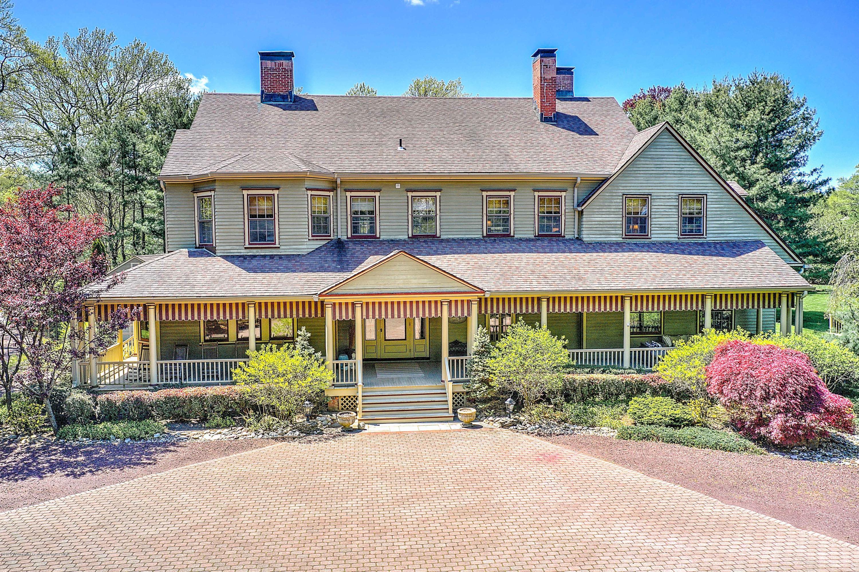 59 Rumson Road Rumson, NJ 07760 - Photo 1 of 62 a front view of a house with a garden