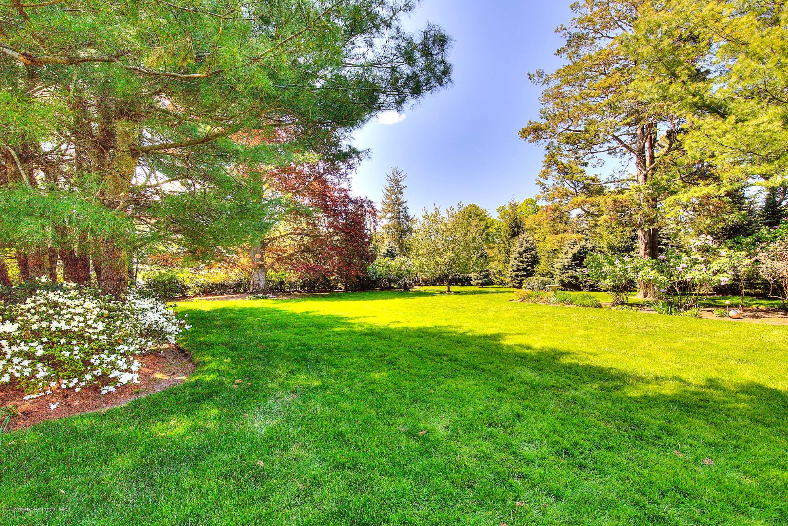 59 Rumson Road Rumson, NJ 07760 - Photo 54 of 62 a view of yard and swimming pool with green space
