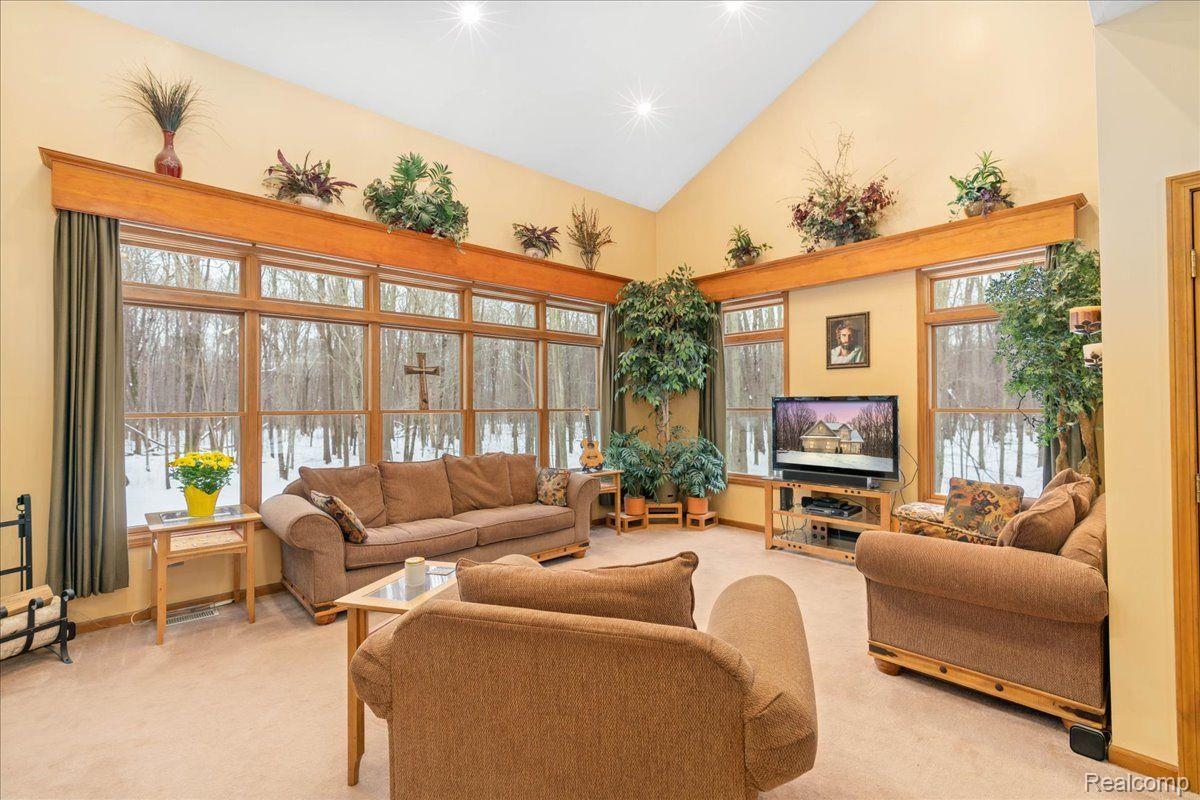 21851 Prince Road Belleville, MI 48111 - Photo 10 of 59 Living room with picture windows to enjoy views