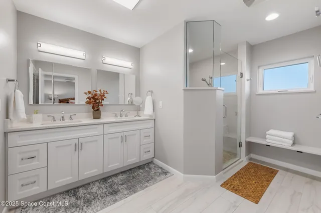 a bathroom with a sink a mirror and a toilet