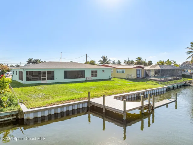 a view of a swimming pool with a lounge chair