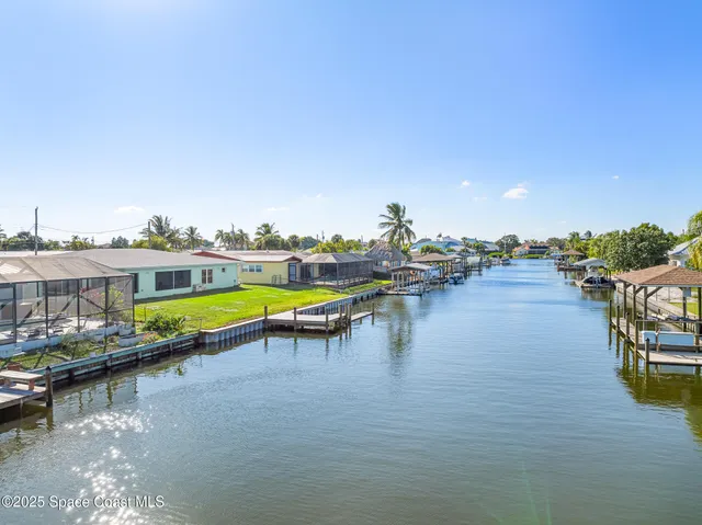 a view of a swimming pool with outdoor seating