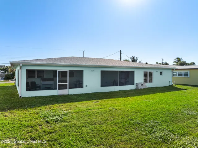 a house with swimming pool in front of it