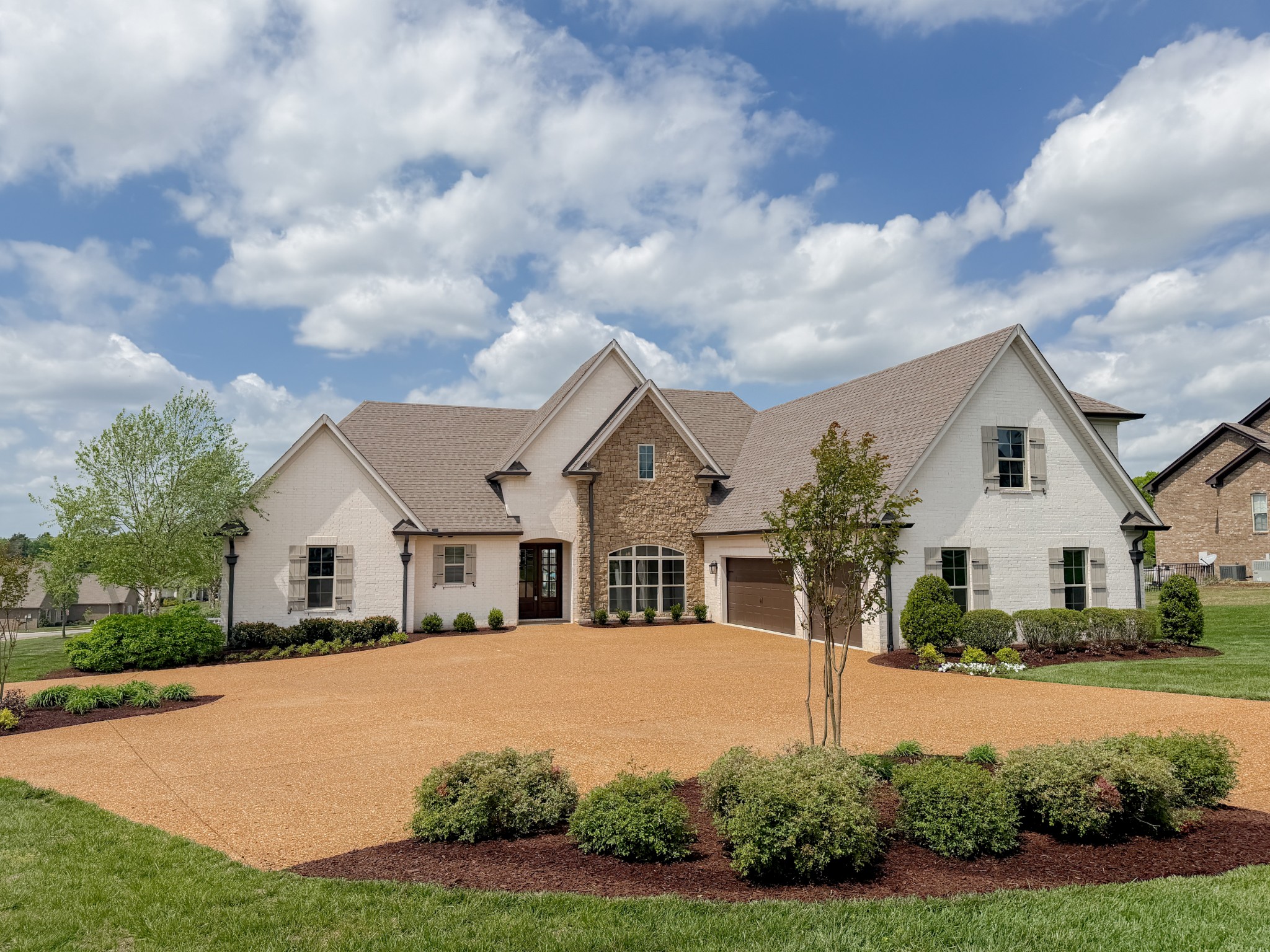 a front view of a house with a yard