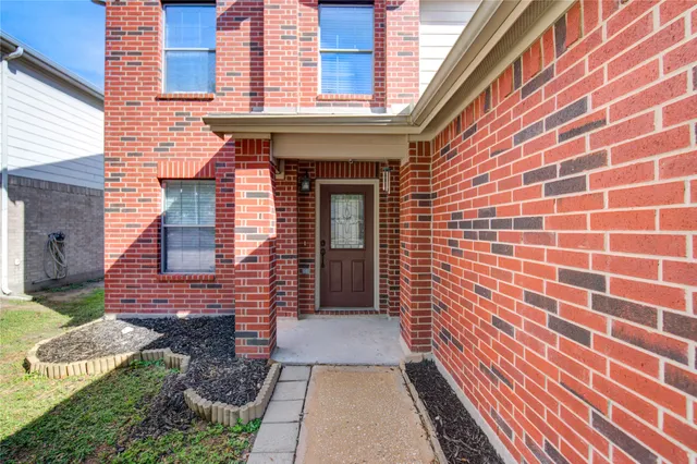 a view of a brick house with a door