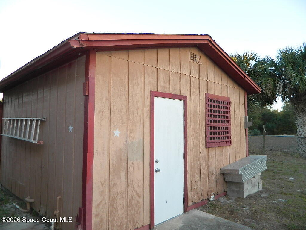 3755 Main Street Sebastian, FL 32976 - Photo 11 of 12 a front view of a house with garden