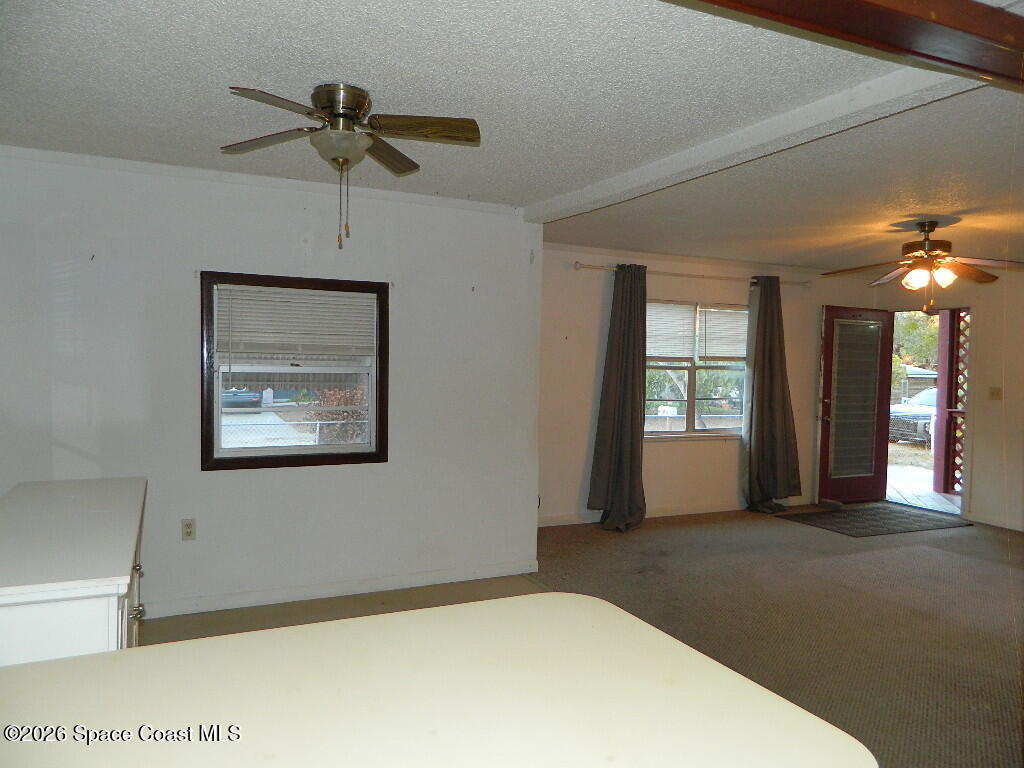 3755 Main Street Sebastian, FL 32976 - Photo 2 of 12 a view of a livingroom with a ceiling fan and window