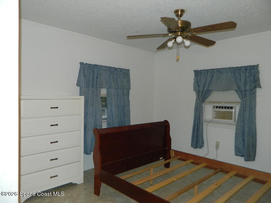 3755 Main Street Sebastian, FL 32976 - Photo 6 of 12 a room with closet and wooden floor