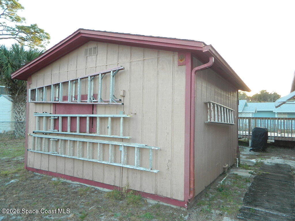 3755 Main Street Sebastian, FL 32976 - Photo 10 of 12 a view of a house with a yard