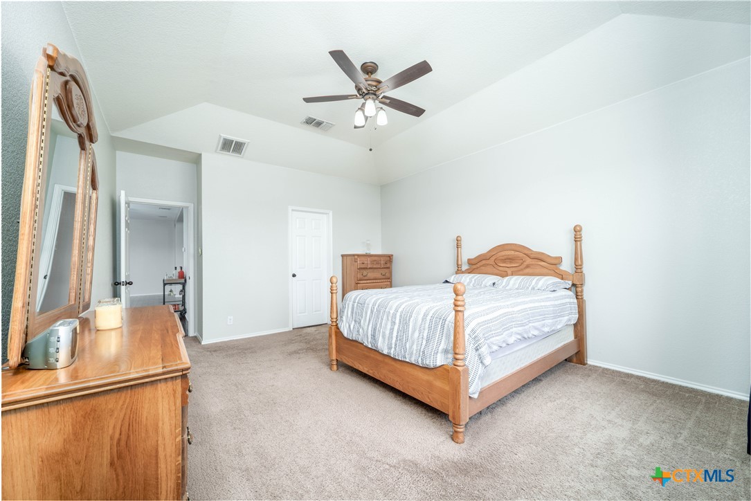 232 Pevero Cibolo, TX 78108 - Photo 10 of 42 a bedroom with a bed and a ceiling fan