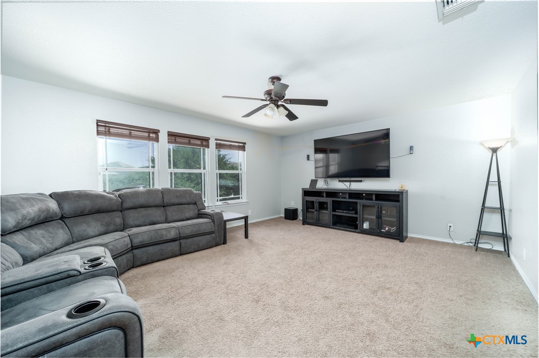 232 Pevero Cibolo, TX 78108 - Photo 15 of 42 a living room with furniture and a flat screen tv