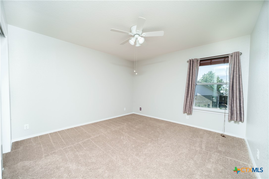 232 Pevero Cibolo, TX 78108 - Photo 17 of 42 an empty room with window and ceiling fan
