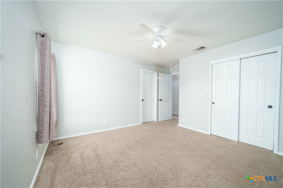 232 Pevero Cibolo, TX 78108 - Photo 18 of 42 a view of an empty room with a chandelier fan