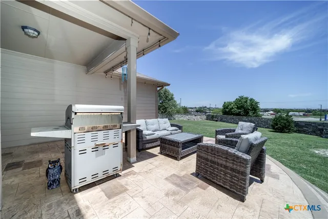 a view of a back yard from a porch