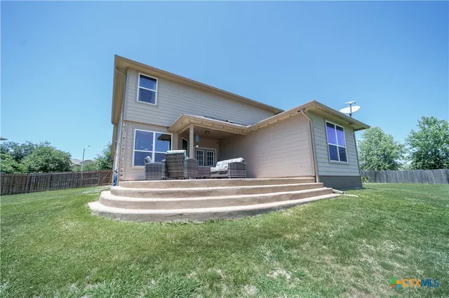a view of a terrace with couches and a table