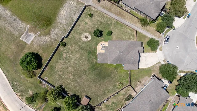 an aerial view of a house having yard