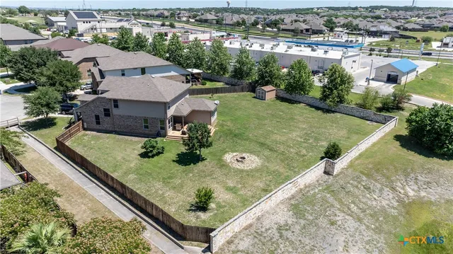 an aerial view of a house with a ocean view