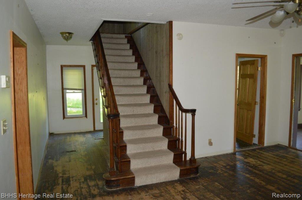 2450 East Coon Lake Road Howell, MI 48843 - Photo 30 of 49 Beautiful wood open staircase