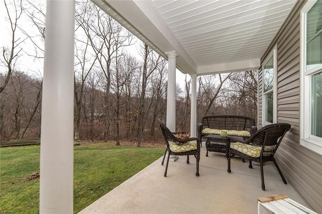 486 Moores Grove Road New Stanton, PA 15672 - Photo 2 of 25 SPACIOUS PRIVATE FRONT PORCH.