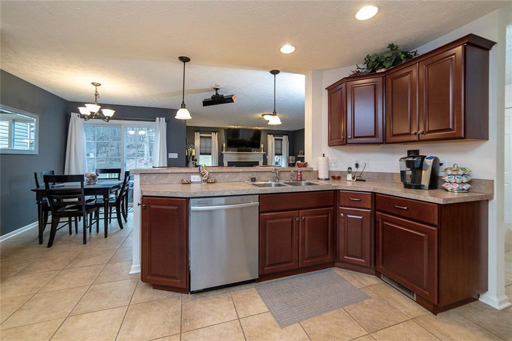 486 Moores Grove Road New Stanton, PA 15672 - Photo 11 of 25 KITCHEN OPENS TO BREAKFAST AREA, DECK AND LIVING ROOM.