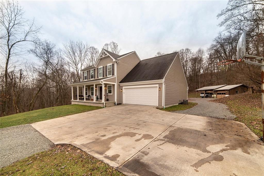 486 Moores Grove Road New Stanton, PA 15672 - Photo 6 of 25 ATTACHED 2 CAR GARAGE WITH SEPARATE GARAGE AND CAR PORT