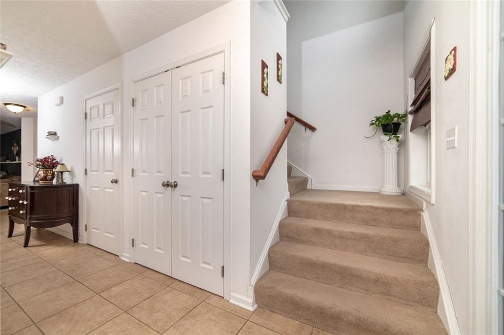 486 Moores Grove Road New Stanton, PA 15672 - Photo 7 of 25 LARGE FRONT HALLWAY, 18X7, WITH STORAGE AND ACCESS TO 1ST FLOOR POWDER ROOM.
