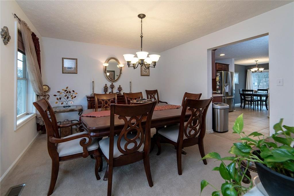 486 Moores Grove Road New Stanton, PA 15672 - Photo 8 of 25 FORMAL DINING ROOM WITH ACCESS TO KITCHEN, BREAKFAST AREA AND LIVING ROOM.