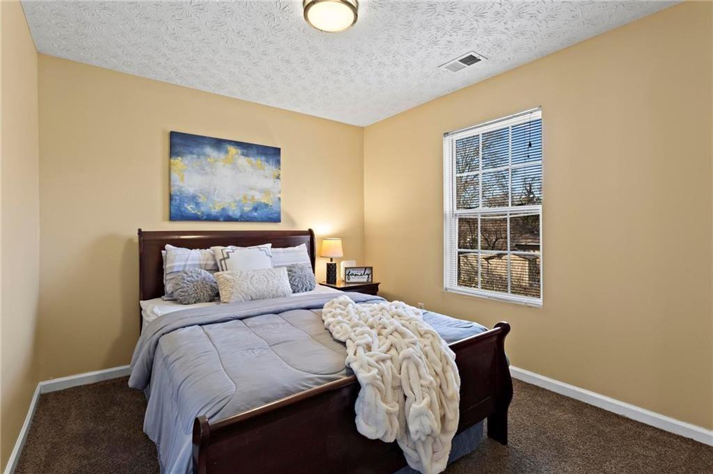 392 4th Street Forest Park, GA 30297 - Photo 17 of 21 a bedroom with a bed and a window