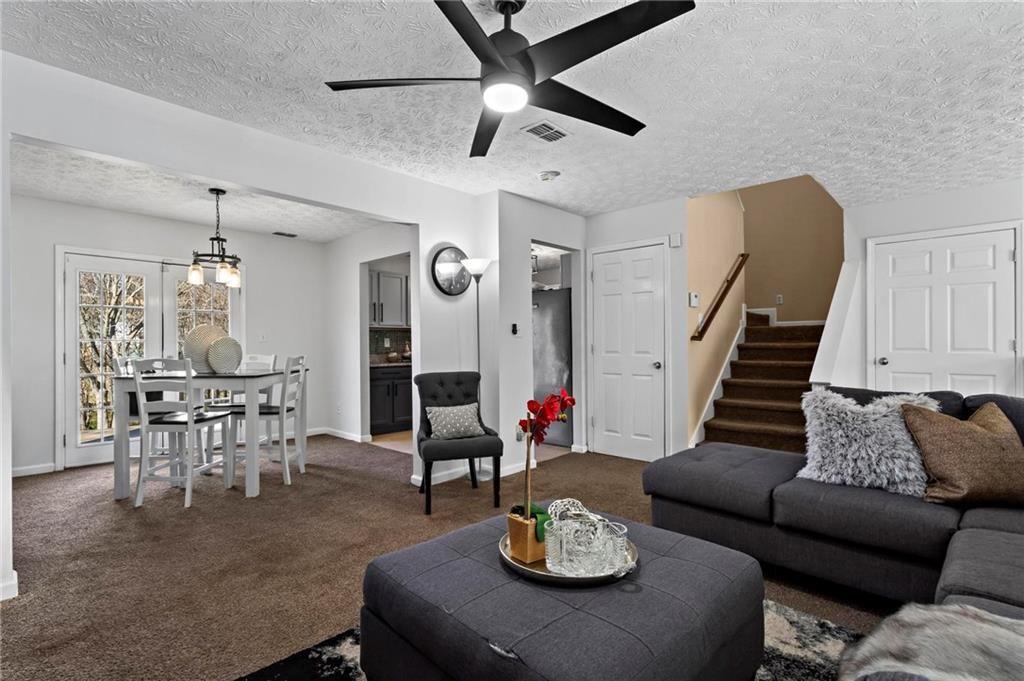 392 4th Street Forest Park, GA 30297 - Photo 5 of 21 a living room with furniture and a dining table