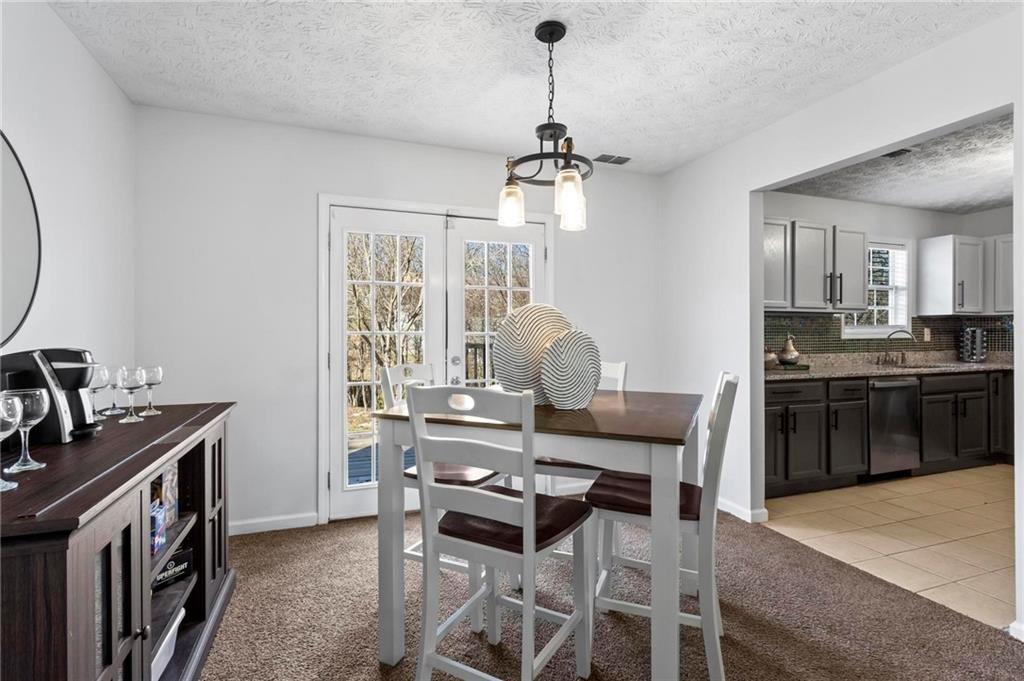 392 4th Street Forest Park, GA 30297 - Photo 7 of 21 a view of a dining room with furniture window and wooden floor