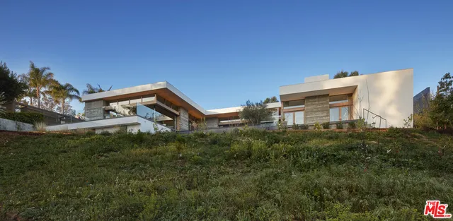 a view of a large building with a swimming pool