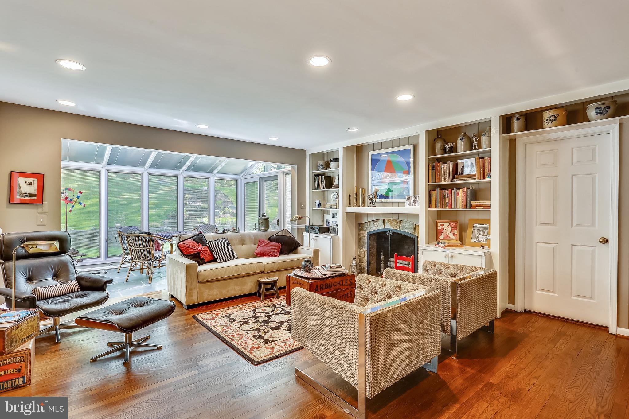10104 Logan Drive Potomac, MD 20854 - Photo 11 of 59 Family room off kitchen with glassed in sunroom