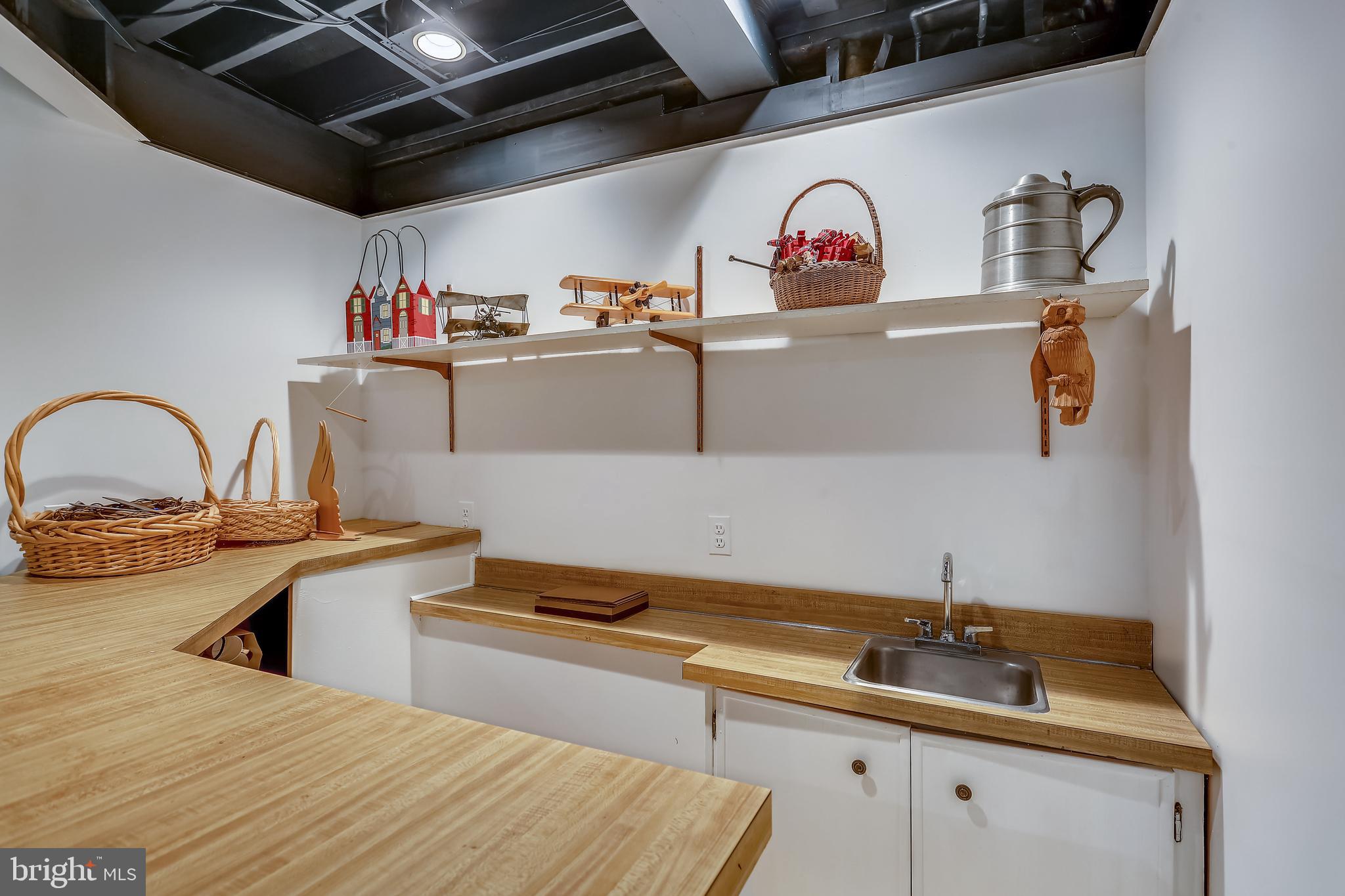 10104 Logan Drive Potomac, MD 20854 - Photo 36 of 59 Wet bar in lower level rec room