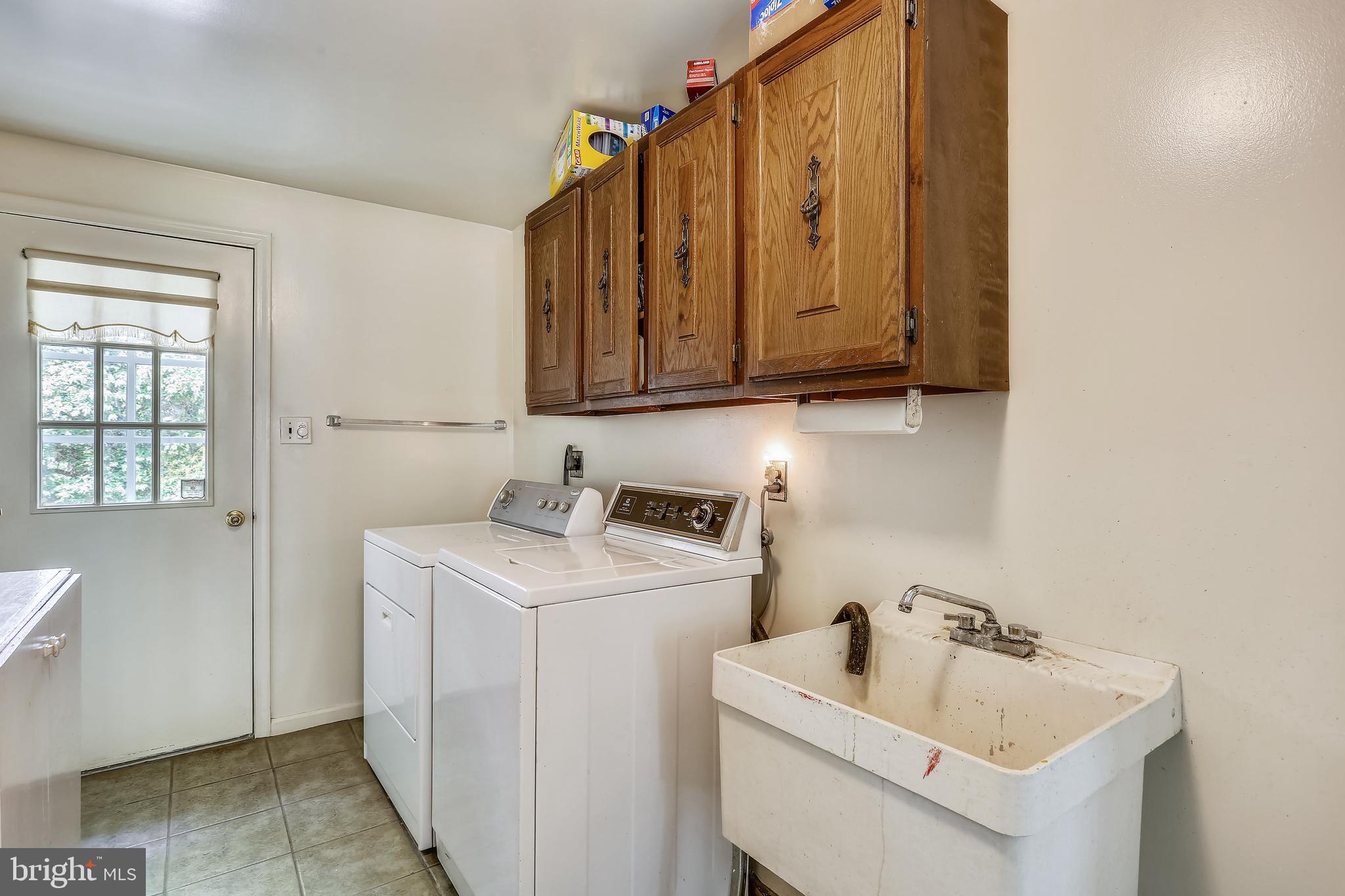 10104 Logan Drive Potomac, MD 20854 - Photo 37 of 59 Laundry room exits to garage, back & front yards