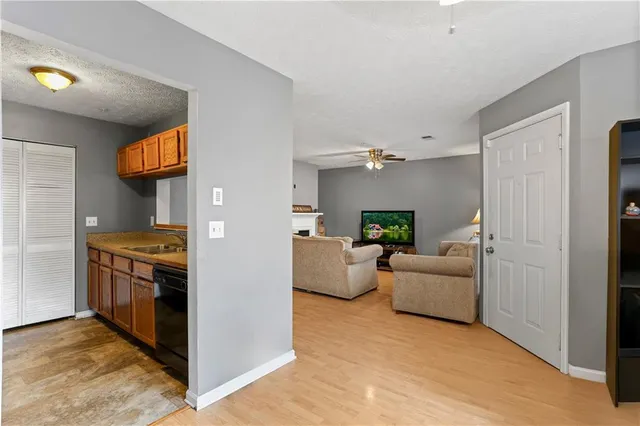 a kitchen with stainless steel appliances granite countertop a stove and a refrigerator