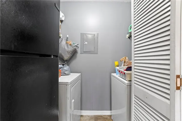 a front view of house with yard and trees around