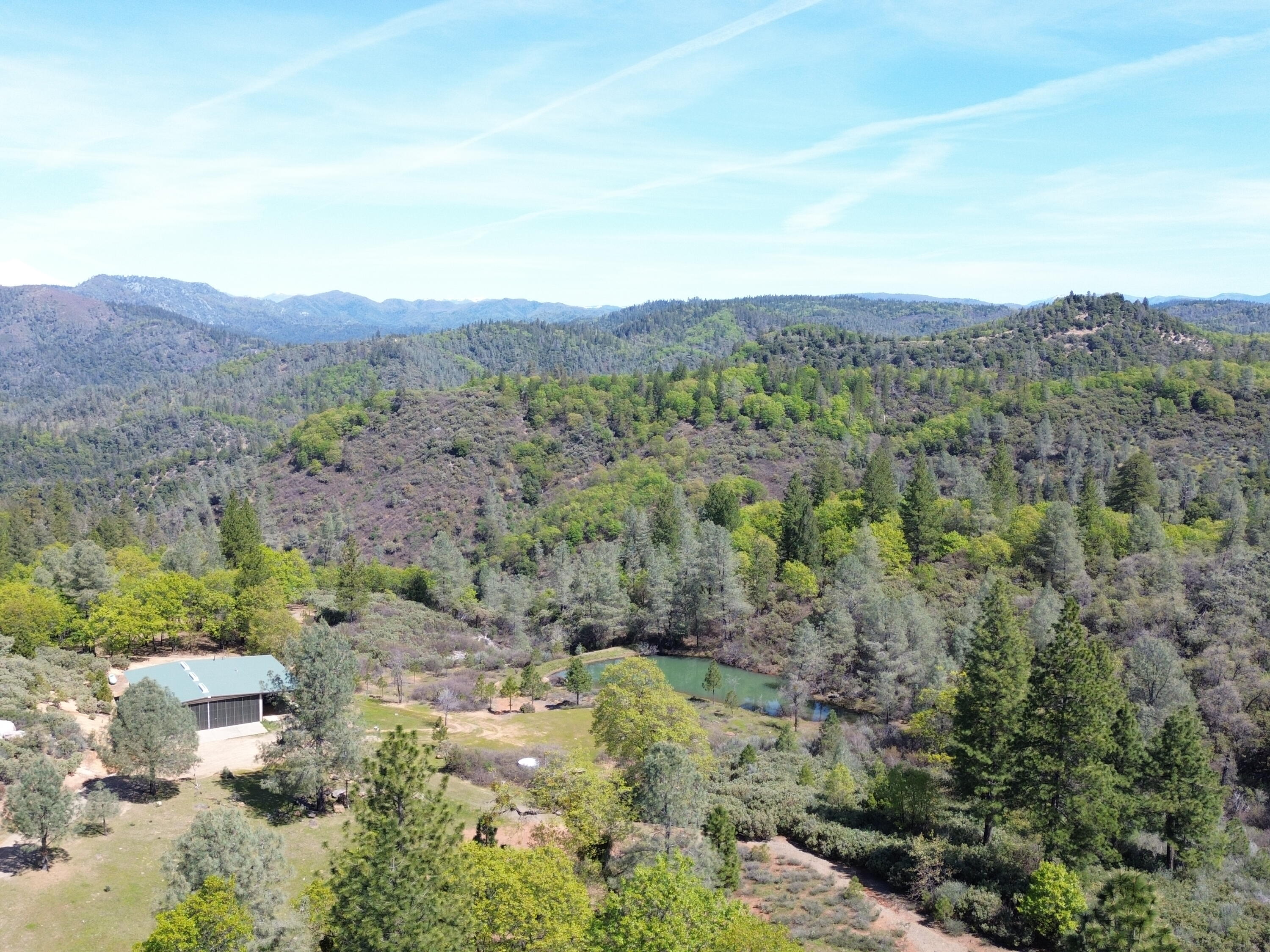 Backbone Road Bella Vista, CA 96008 - Photo 3 of 42 a view of a city with lush green forest