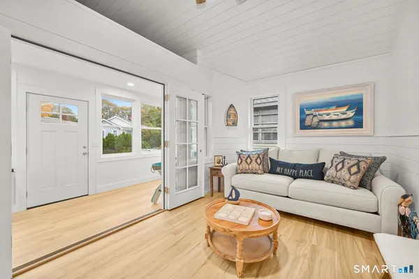 a living room with furniture and flat screen tv