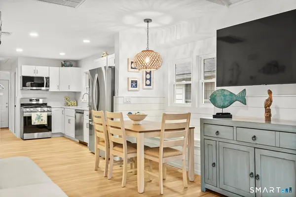 a view of a kitchen with furniture and chandelier