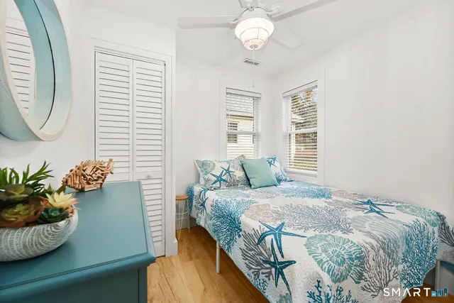 a bedroom with a bed and a chair