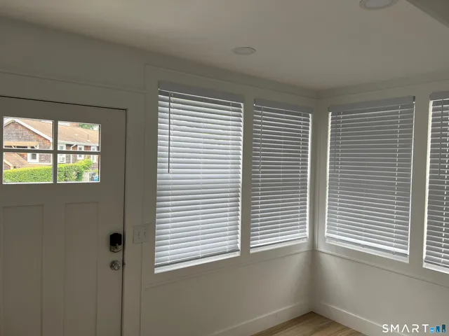 a view of an empty room with a window
