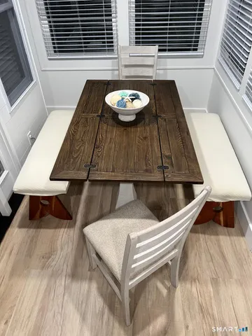 a view of table and chair with wooden floor